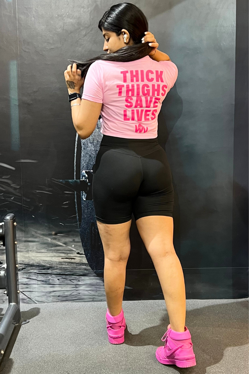 THICK THIGHS SAVE LIVES (CROPPED) TEE IN BABY PINK